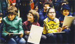Children's smiles say that the teacher is giving them positive feedback.